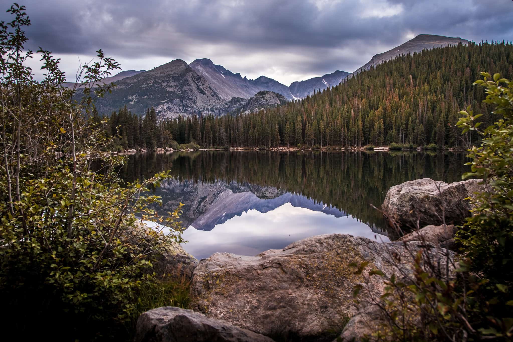 Mountains reflecting on a lake in one of Colorado's national parks