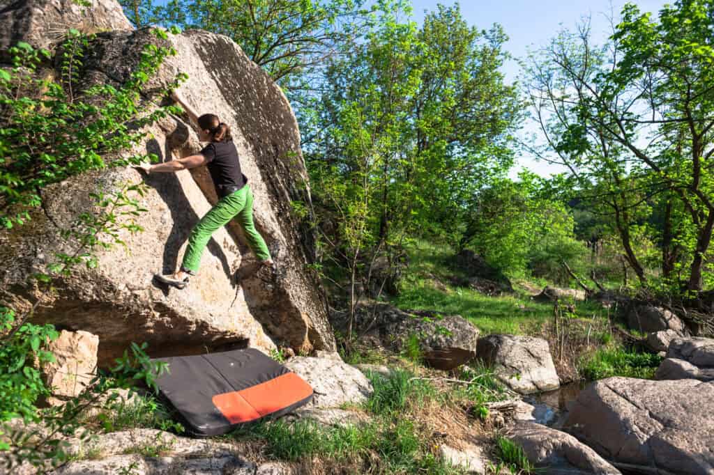 Woman bouldering in Longmont, Colorado