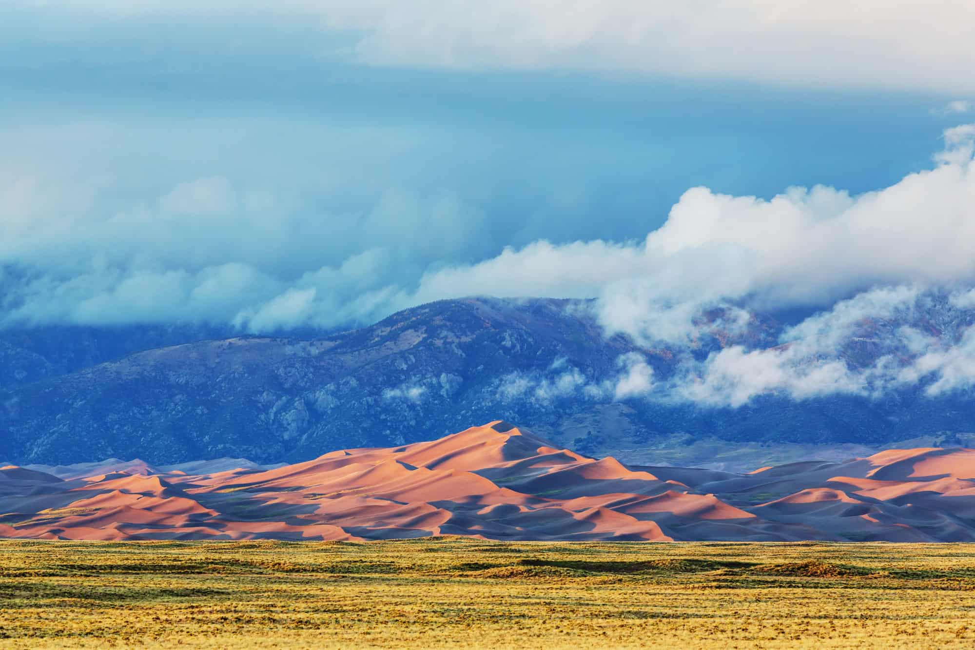 Great Sand Dunes National Park contrasted with mountains behind