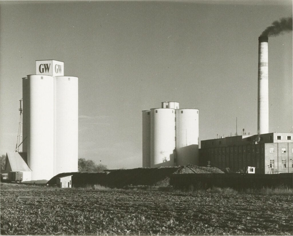 The Longmont Sugar Mill Factory photographed in the 1960s. Great Western Sugar Company branding is visible on the storage silos.