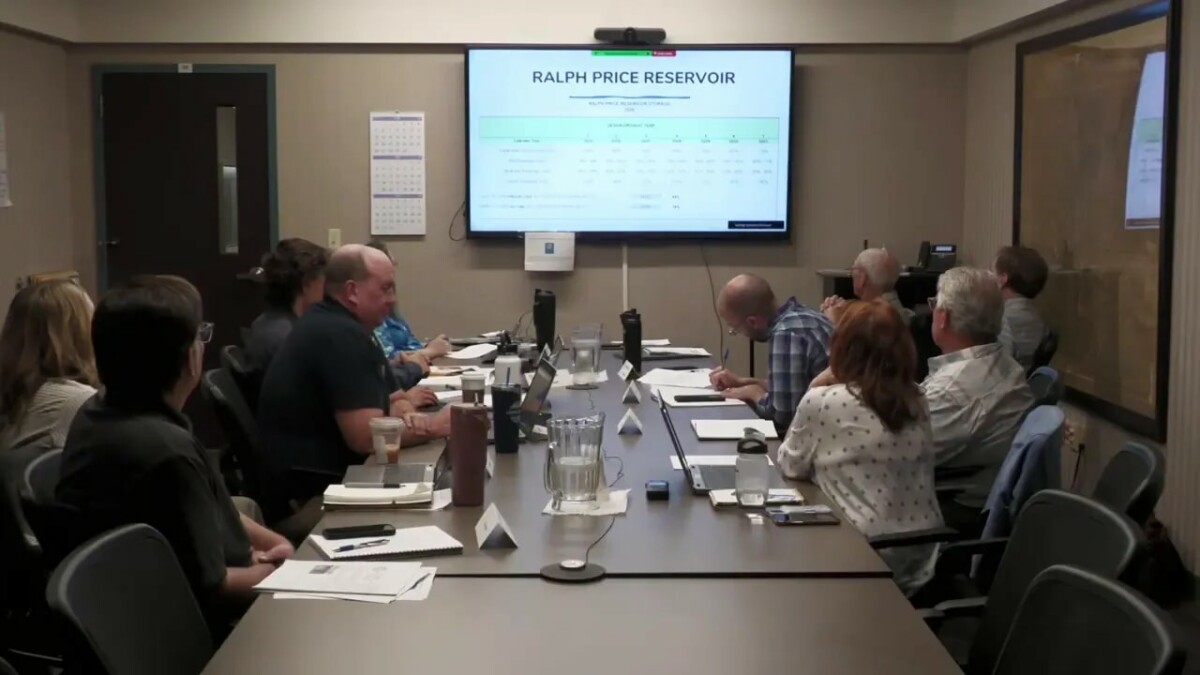 Longmont Water Advisory Board meeting participants reviewing reservoir information displayed as “RALPH PRICE RESERVOIR”